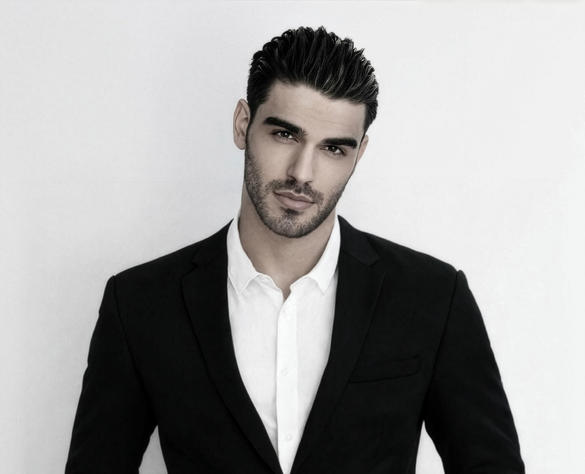 Firat Zan in a black suit for a 2026 global investment strategy article